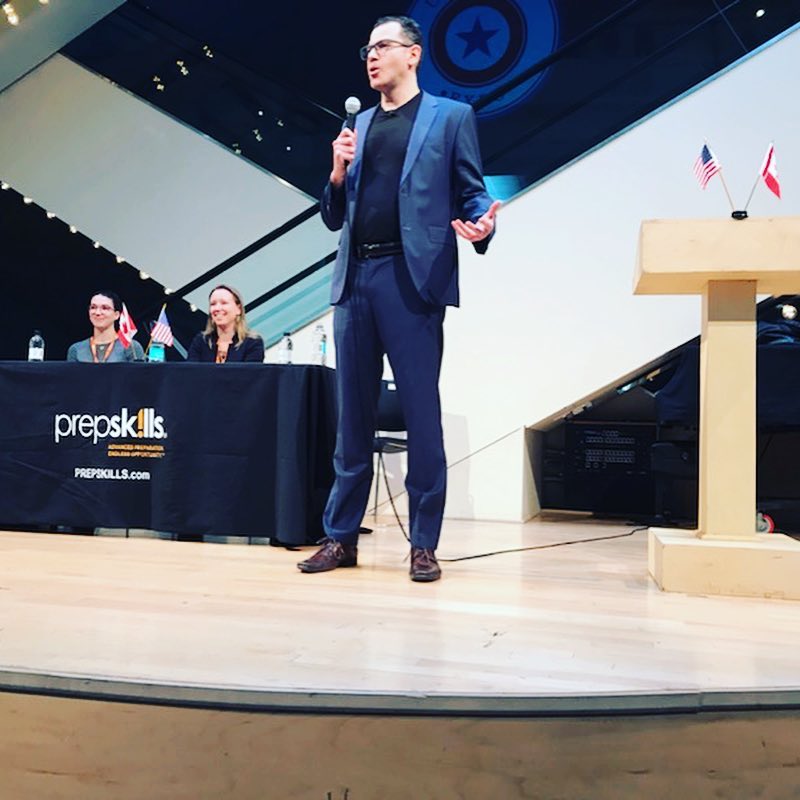 Elan Divon speaking on stage